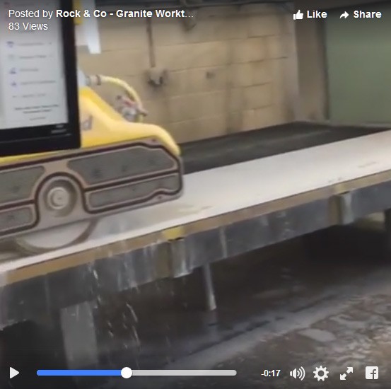 customer watching worktops being cut