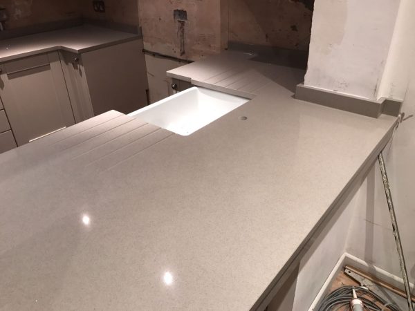 nebbia grigia grey quartz by urban quartz in shaker style kitchen