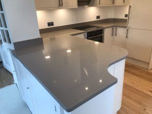 magnifico de lusso grey quartz worktops with high gloss white kitchen