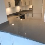 magnifico de lusso grey quartz worktops with high gloss white kitchen