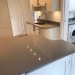 magnifico de lusso grey quartz worktops with high gloss white kitchen