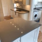 magnifico de lusso grey quartz worktops with high gloss white kitchen