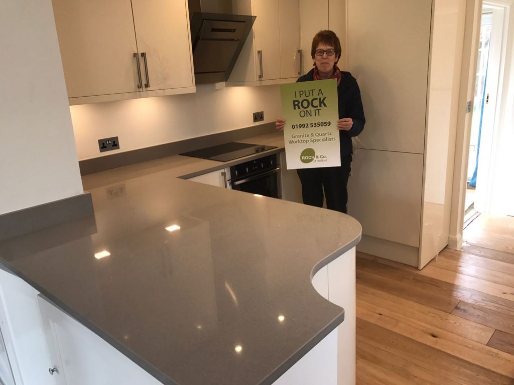 magnifico de lusso grey quartz worktops with high gloss white kitchen