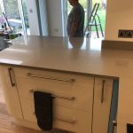 magnifico de lusso grey quartz worktops with high gloss white kitchen