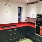 red starlight rosso stella urban quartz with grey glossy kitchen