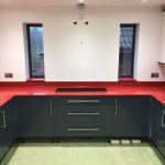 red starlight rosso stella urban quartz with grey glossy kitchen