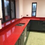 red starlight rosso stella urban quartz with grey glossy kitchen