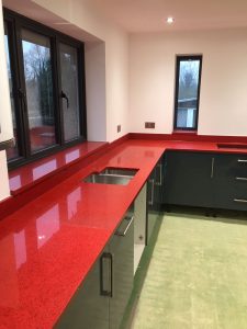 red starlight rosso stella urban quartz with grey glossy kitchen