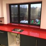 red starlight rosso stella urban quartz with grey glossy kitchen