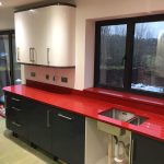 red starlight rosso stella urban quartz with grey glossy kitchen