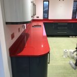 red starlight rosso stella urban quartz with grey glossy kitchen