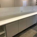 bianco nevoso white quartz installed in grey gloss kitchen dane end ware