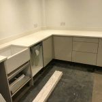 bianco nevoso white quartz installed in grey gloss kitchen dane end ware