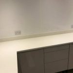 bianco nevoso white quartz installed in grey gloss kitchen dane end ware