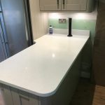 bianco marmo suprema in taupe kitchen by rock and co