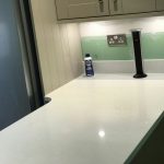 bianco marmo suprema in taupe kitchen by rock and co