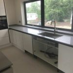 grigio chiaro pura quartz worktops in grey high gloss kitchen