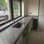 grigio chiaro pura quartz worktops in grey high gloss kitchen