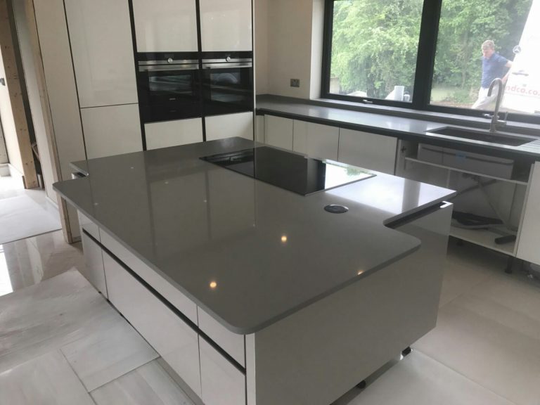 grigio chiaro pura quartz worktops in grey high gloss kitchen