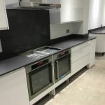 grigio scuro pura dark grey quartz worktops in white gloss kitchen