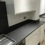 grigio scuro pura dark grey quartz worktops in white gloss kitchen
