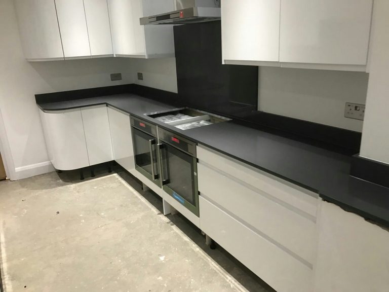 grigio scuro pura dark grey quartz worktops in white gloss kitchen