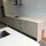 bianco de lusso white quartz worktops in grey kitchen