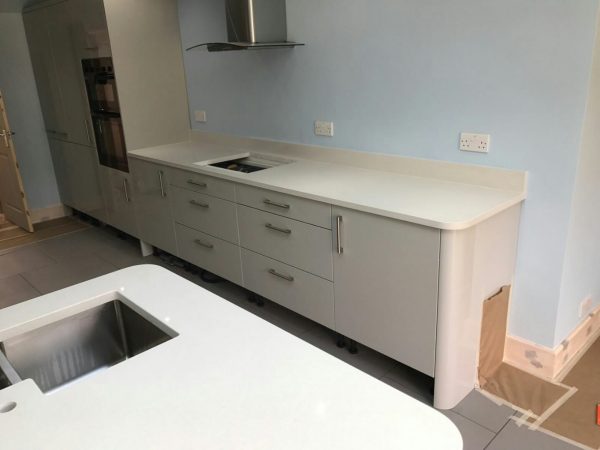 bianco de lusso white quartz worktops in grey kitchen