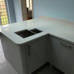 bianco de lusso white quartz worktops in grey kitchen