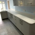 bianco de lusso white quartz worktops in grey kitchen