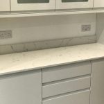 carrera quartz worktops in white high gloss kitchen