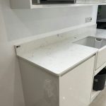 carrera quartz worktops in white high gloss kitchen