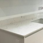 carrera quartz worktops in white high gloss kitchen