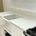 carrera quartz worktops in white high gloss kitchen