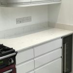 carrera quartz worktops in white high gloss kitchen