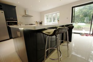 bianco puro pure white quartz worktops in blue traditional kitchen