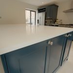 bianco puro pure white quartz worktops in blue traditional kitchen