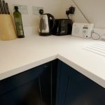 bianco puro pure white quartz worktops in blue traditional kitchen