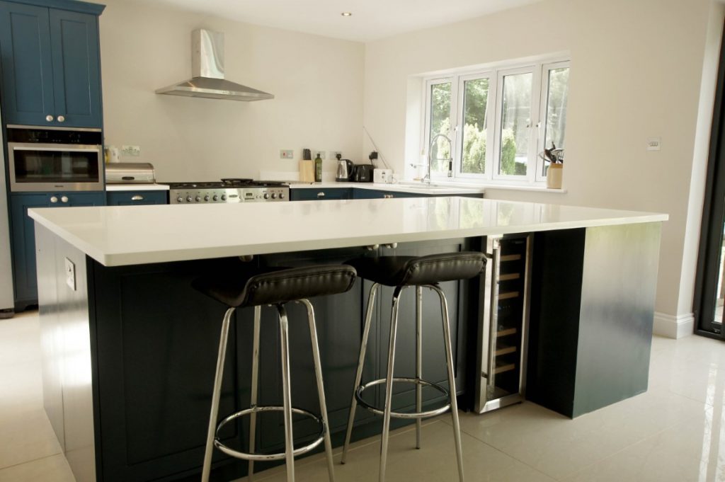 bianco puro pure white quartz worktops in blue traditional kitchen