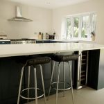 bianco puro pure white quartz worktops in blue traditional kitchen