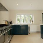 bianco puro pure white quartz worktops in blue traditional kitchen