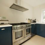 bianco puro pure white quartz worktops in blue traditional kitchen