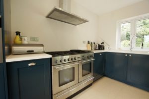 bianco puro pure white quartz worktops in blue traditional kitchen