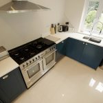 bianco puro pure white quartz worktops in blue traditional kitchen