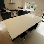 bianco puro pure white quartz worktops in blue traditional kitchen