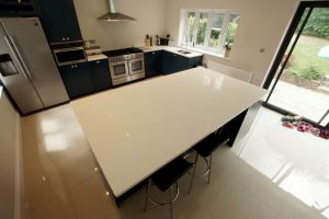 bianco puro pure white quartz worktops in blue traditional kitchen