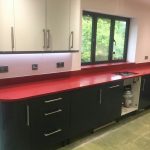 rosso stella red starlight quartz worktops in grey kitchen