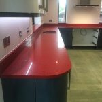 rosso stella red starlight quartz worktops in grey kitchen