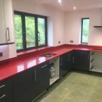 rosso stella red starlight quartz worktops in grey kitchen