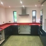 rosso stella red starlight quartz worktops in grey kitchen